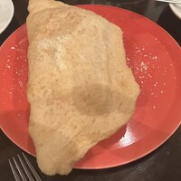 メルジェリーナ - 燻製チーズとイタリア産ハムの上揚げピッツァ