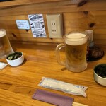 魚善 - 生ビール　お通し（ワカメとタコの酢の物）