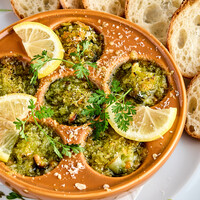 Escargot de Bourgogne with thinly sliced baguette