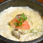 Cheese risotto with stone-grilled clams