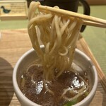 らぁ麺 鴨と葱  梅田店 - つけ汁に麺を絡ませているところ