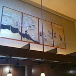 Kohi Sha Kamon - レジの上には絵が掲げられています。
