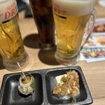 海鮮・串焼き 満天 - 付出し ¥440 小さいサザエと冷奴