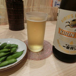 Dontaku - 瓶ビール（キリン）600円。お通し。