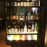 銀座　あまくさ - 九州の各種地焼酎が並ぶ入り口