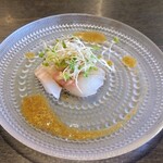 鉄板焼きINAGAKI亭 - 真鯛のカルパッチョ♪(わさびのドレッシング添え)
                                一味違うまろやかな旨味♪