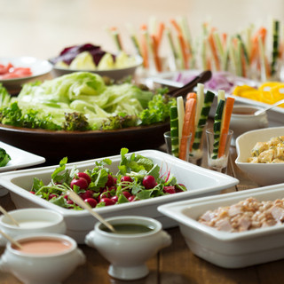 The salad bar is full of seasonal fresh vegetables.