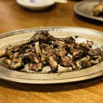 丸万焼鳥 - もも焼きバラシ