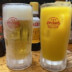 大衆串揚酒場 足立屋 - オリオンドラフト生とマンゴージュース