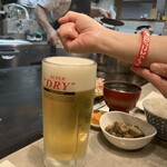 いか玉屋プラスアルファー - このリストバンドをつけてるとイカ玉は生ビール100円だ！