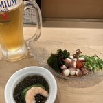 沼津魚がし鮨 横浜ランドマーク店 - お通しのもずく酢と蛸の吸盤