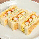 コンパル - 料理写真:エビフライ３本、ふんわり玉子をカツソースとタルタルソースのダブルソースを使ってトーストパンでサンドしました。テレビ、雑誌の取材で必ず取り上げられるコンパルを代表するサンドイッチです。