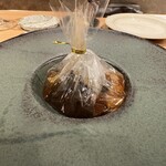 A Delicious Service - SOUP　岩手県産 茸コンソメスープ、耐熱ビニールに入ったままサーブ