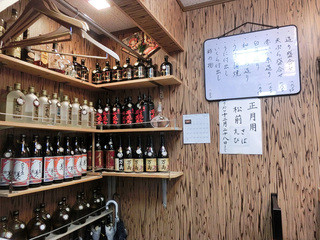 h Manryou - お店の名前の焼酎もある。価格表示有り。