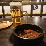 大衆酒場 もんろう - 自家製モツ煮込み