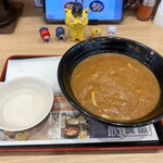 資さんうどん - 料理写真:カレーぶっかけうどん　669円(税込)　※紙エプロン付き