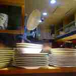 ポンチ軒 - 皿の壁の奥でライス&カツが作られ盛られる様子を見つつ