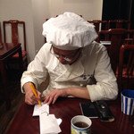 趙楊 - 2014年12月上旬某日。月末の趙楊の会に備えて、メニューを考える趙楊さんの図。