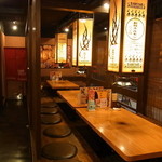 松本酒場　情熱ホルモン - 系列店の店内です。