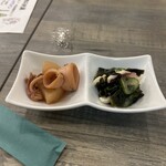 魚彩イカのアジト． - お通し。特に左のイカ大根が柔らかい仕上がりで良き。
