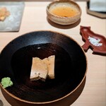 たかおか - 銚子の鮟鱇の肝。甘めのお出汁で温泉に浸かるように煮込まれています。脂タップリなので、山葵タップリでいただきます。