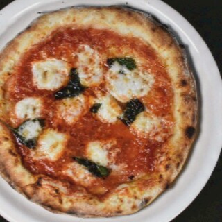 Crispy on the outside, chewy on the inside! Carefully baked pizza with homemade dough.