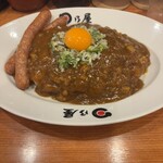 日乃屋カレー - 料理写真:ウインナーカレーに納豆トッピング。
