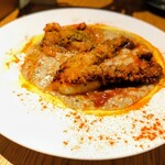 魚工房 としまや - 北海真ダコのパン粉焼き　白豆ときのこのソース　モロッコ風