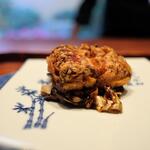 Hirosawa - Large Deep-fried Anago (Conger Eel). Served on a bed of garlic black vinegar sautéed cabbage. The flavors of the fried eel and cabbage complement each other beautifully! 