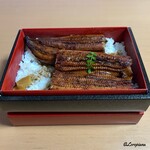 駒龍 - ごはんの上に蒲焼を移し