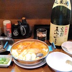 うましくに - 海鮮鍋（ピリ辛風味）690円　具は鮭、イカ、貝、海老、タラ、カニ団子、牡蠣、豆腐、エノキ、ネギ、キムチ、人参、ボリュームたっぷりで美味しかったです♪