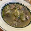 大衆イタリアンかね子 - イタリアンなもつ煮473円　塩ベースの煮込みにジェノベーゼソースと少しチーズがかかってる感じ。ジェノベーゼのニンニクがいいアクセント！大根入り。