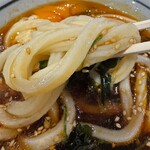 丸亀製麺 - 旨辛豚つけ汁につけて