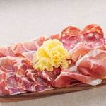 Assortment of 4 types of freshly cut Prosciutto and salami
