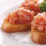 Chopped tomato bruschetta (4 pieces)