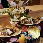 Ginza Shinohara - Appetizer Platter – Firefly Squid, Cheese-Wrapped Yellow-Bark Tofu, Braised Scallop with Kinshi Egg, Skewered Braised Abalone, Karasumi Mochi, Sayori Egg Sushi, Skewered Braised Octopus, Aori Ika, Mozuku Vinegar with Hokkigai, Pickled Paprika, Tomato, and Corn, Hida Beef Tartare, Sweet Shrimp Marinated in Brandy