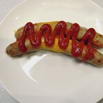 ユンゲ モルゲン - 焼きソーセージ（400円）持ち帰りのためケチャップ塗り直しです
