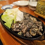 藁焼き炉端 海風土 - 地鶏のもも焼き