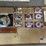 だるま大使 - 入り口壁際にメニューの写真が掲示されてました☆