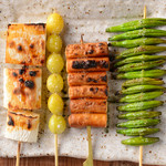 Grilled vegetables and various skewers