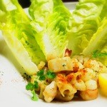 Ethnic-style stir-fried shrimp and Ethnic Cuisine root served with romaine lettuce shipped directly from Spain