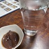 魚吉 - ホタルイカ醤油漬けと芋焼酎（いいちこ）のお湯割り