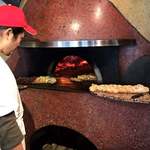 SAKURAGUMI - 魚のピッツァ焼いてます