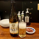 麺飯坊　無双 - 瓶ビール650円、無料のピーナツ