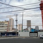 源蔵本店 - 店を出て右手には、広島駅前再開発Ｃブロックです。荒神市場があった場所です。