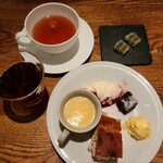 MORETHAN TAPAS LOUNGE - This is a dessert. The cup contains panna cotta under apple jelly.