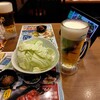 旨唐揚げと居酒メシ ミライザカ - お通し　330円/人＋プレミアムモルツ中生　328円