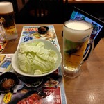 旨唐揚げと居酒メシ ミライザカ - お通し　330円/人＋プレミアムモルツ中生　328円