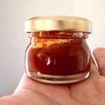 飯屋 楽 - おみやで持たされた紙袋の中身は自家製の辛味噌。これはアカン。このあとあっという間にご飯と共に胃袋に消えてしまいました。