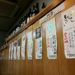酒処かくえい - 壁に貼られた日本酒メニュー